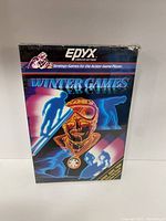Front view of the sealed Atari 2600 Winter Games game box with original shrink wrap intact, featuring retro winter sport-themed artwork.