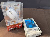 Original sealed packaging of Genius Traveler 9000 wireless BlueEye mouse in white, showing front and branding.
