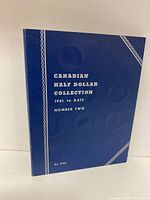 Blue hardcover book titled 'CANADIAN HALF DOLLAR COLLECTION 1961 to DATE NUMBER TWO' in white text.