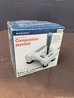 Front top angle photo of the Archer Super-deluxe Competition Joystick in its original box showing the product image and box wear.