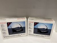 Two sealed Craig JC6111 personal compact disc players in their original box packaging showing product images and branding.