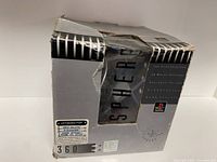 Damaged original box with PlayStation and Space Orb 360 branding, showing wear and scuffs.
