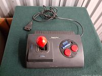 Full view image of the QuickShot QS-172 joystick showing red ball top joystick handle, two red buttons on right, black body with cable attached