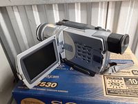 Sony Digital8 Handycam TRV 530 with LCD screen flipped out, displayed on its original box.