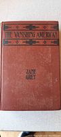 Front cover of the antique book 'The Vanishing American' by Zane Grey, showing title, author, and design details.