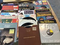 Overview of 20 LP records laid out, showing various album covers including Luciano Pavarotti, Charlie Daniels Band and Elvis Presley.