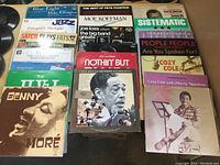 Photo showing front view of 20 jazz and soul LP records including Duke Ellington, Benny Moré, Cozy Cole, Moe Koffman.