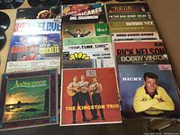 Full layout of all 20 LP records arranged in rows, showing a variety of artists and album titles visible on the covers.