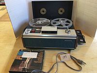 Full view of Sony TC-106 reel to reel tape recorder with reels and accessories including Columbia album and instruction manual