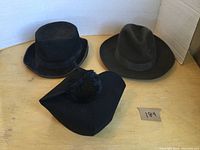 Overview of three vintage felt hats: two structured hats and one beanie with pom-pom