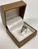 Ring displayed in brown jewelry box showing overall appearance