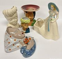 All five vintage signed pottery planters displayed together, showing various bust and figurine styles.