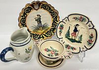 Group photo showing 4.75 inch double-handle porridge bowl, 8 inch plate, 5 inch creamer, a small plate, and small bowl with floral and folk art decoration.