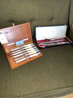 Two sets: Haddon Hall carving set with knives, fork and sharpening steel in original box, Prestige steak knife set with six knives in mahogany case.