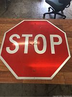 Full view of red STOP sign showing shape, color and condition.