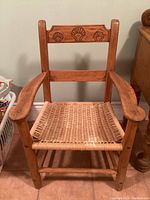 Front view of the wooden armchair.