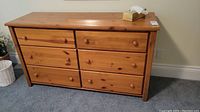 Front view of the wood dresser.