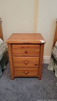 Front view showing three closed drawers