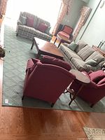 Living room view showing full rug under seating