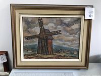 Framed watercolor painting of a windmill showcasing the entire front view with frame and glass.