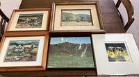 Five framed farm-themed artworks arranged on table showing detail and variety