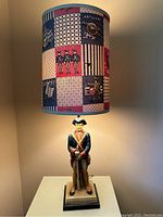 Full view of the 1960 Civil War soldier table lamp with printed fabric shade showing Civil War motif blocks.