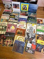 Full collection of 43 vintage vinyl LP records arranged on the floor, showing a variety of artists and album titles.
