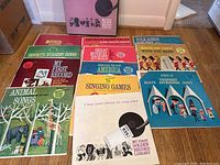 Full set of 12 vintage children's LP records from the My First Golden Record Library collection laid out on floor showing colorful illustrated covers and box set case.
