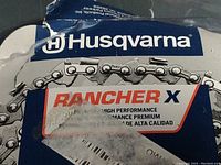 Close-up photo of the Husqvarna Rancher X chainsaw chain packaging showing brand name and part of the chain itself.
