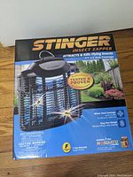 Box front showing Stinger Insect Zapper with coverage details and tested & proven sticker