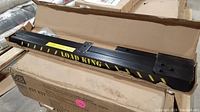 Two Load King branded black steel truck bed extenders in open cardboard box showing full length and mounting points.