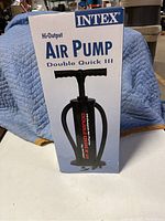 Box front showing the Intex Double Quick III air pump with image of the pump and branding.