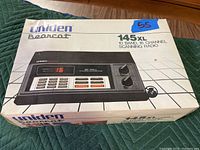 Original box for Uniden Bearcat 145XL police scanner showing product image and key features