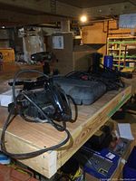 General overview of the power tools lot on a wooden bench including the Craftsman power planer, drills, jigsaw, and other items.