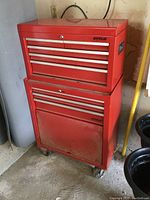 Front angle view of stacked red Waterloo metal top chest and rolling base toolbox