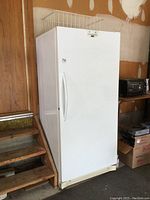 Full front view of freezer in garage