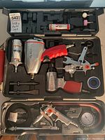 Full view of open case with all tools and accessories neatly arranged inside the molded compartments.