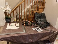 Overview of table with Freud joiner in case, clamps, files, squares, and accessories displayed