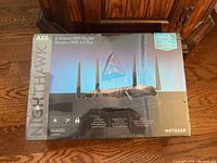 Front of factory sealed box showing Netgear Nighthawk AX6 AX4300 6-Stream WiFi 6 router image and branding