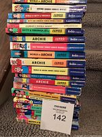Stack of used Archie Comics digests including various titles visible by spine such as Archie Jumbo Comics Digest and Betty & Veronica.