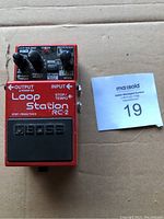 Front view of the red Boss RC-2 Loop Station pedal showing input/output and controls.