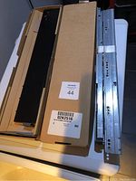 Photo of boxed Blum sliding drawer kit with metal drawer slides and components, packaging labeled with item number 44.