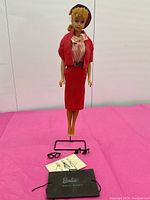 Full front view of Barbie wearing Busy Gal #981 outfit with accessories laid out in front