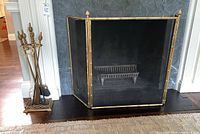 Full view of fireplace screen and tool stand with tools