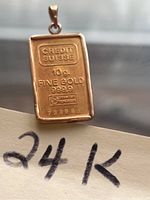 Front view showing 'Credit Suisse', '10g Fine Gold 999.9', assayer mark and serial number on pendant.