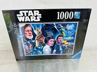 Puzzle box showing full front view including Star Wars logo, 1000 piece count, Ravensburger branding, and puzzle artwork.