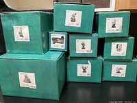 Stack of nine teal Disney Classics Collection boxes, each labeled with character or scene