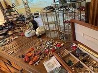 Display towers, jewelry box, assorted jewelry, trinket dishes, perfume bottles visible on table