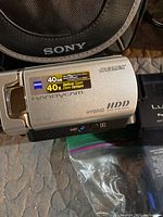 Close-up of silver Sony Handycam with 40GB HDD and Zeiss lens labeling