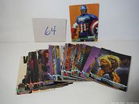 Image showing the spread of over 40 glossy trading cards from 1997 Premium X-Men series. Characters like Captain America and others visible.